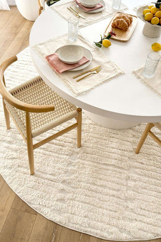 Round rug styled in a bright Australian dining room