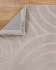 Detailed view of the Ellipse Beige Wool Rug  on timber flooring | Simple Style Co