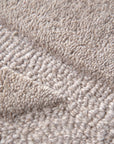 Detailed view of the high low pattern of the Ellipse Beige Wool Rug | Simple Style Co